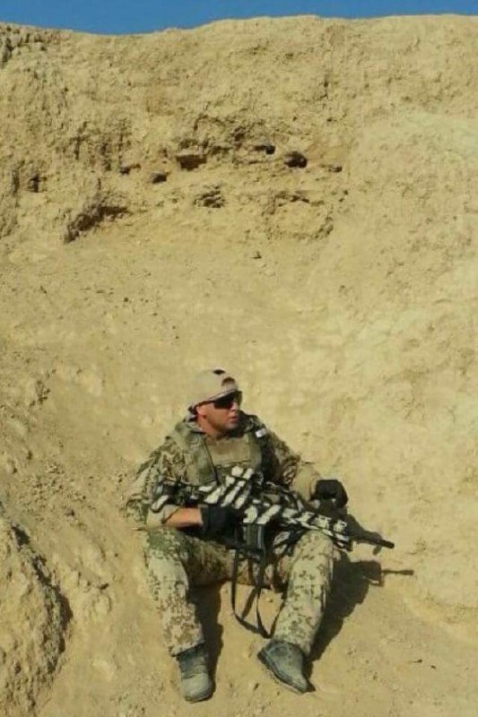 Stanis Zichler resting in the field during deployment